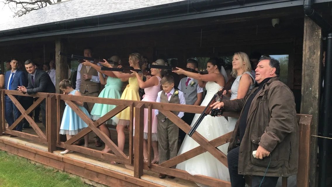 Guests shooting from a barn terrace