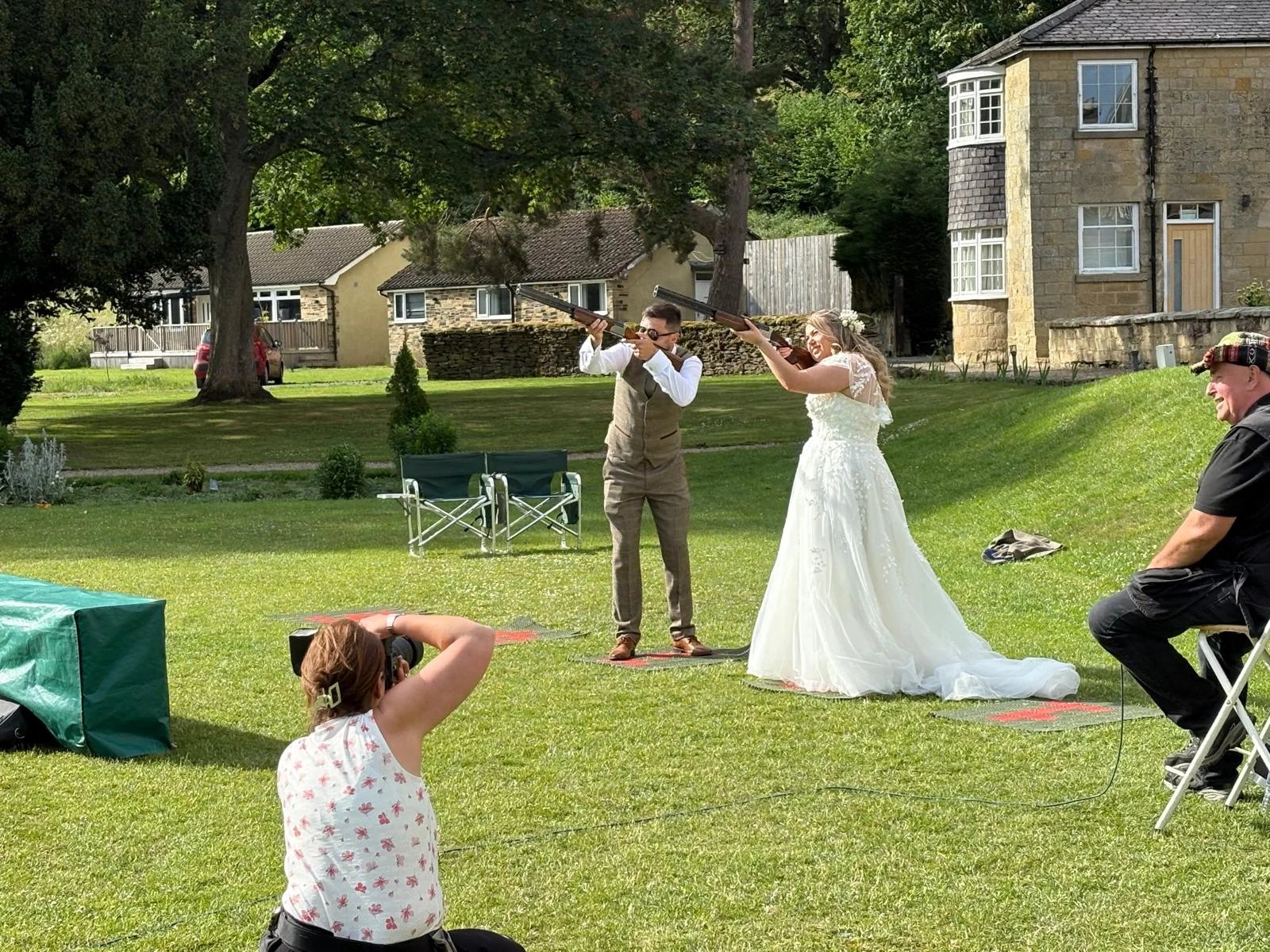 Bride and groom Laser Clay Shooting on the lawn