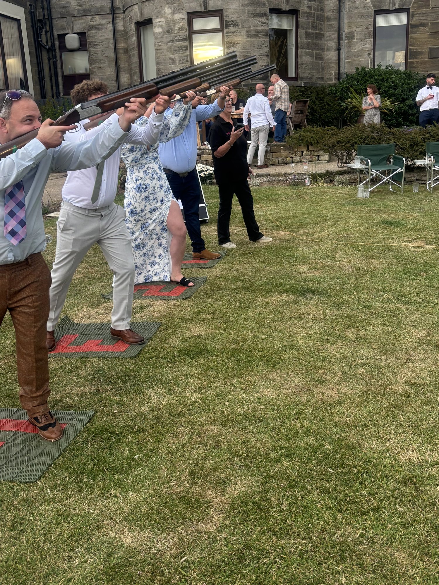 Corporate guests lined up for Laser Clay Shooting