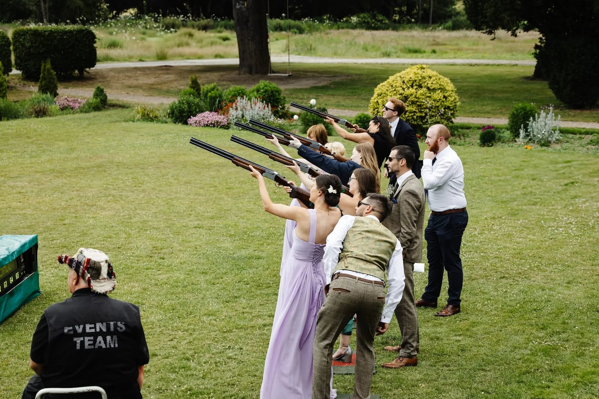 Guests on the peg line at a Laser Clay Shooting garden party
