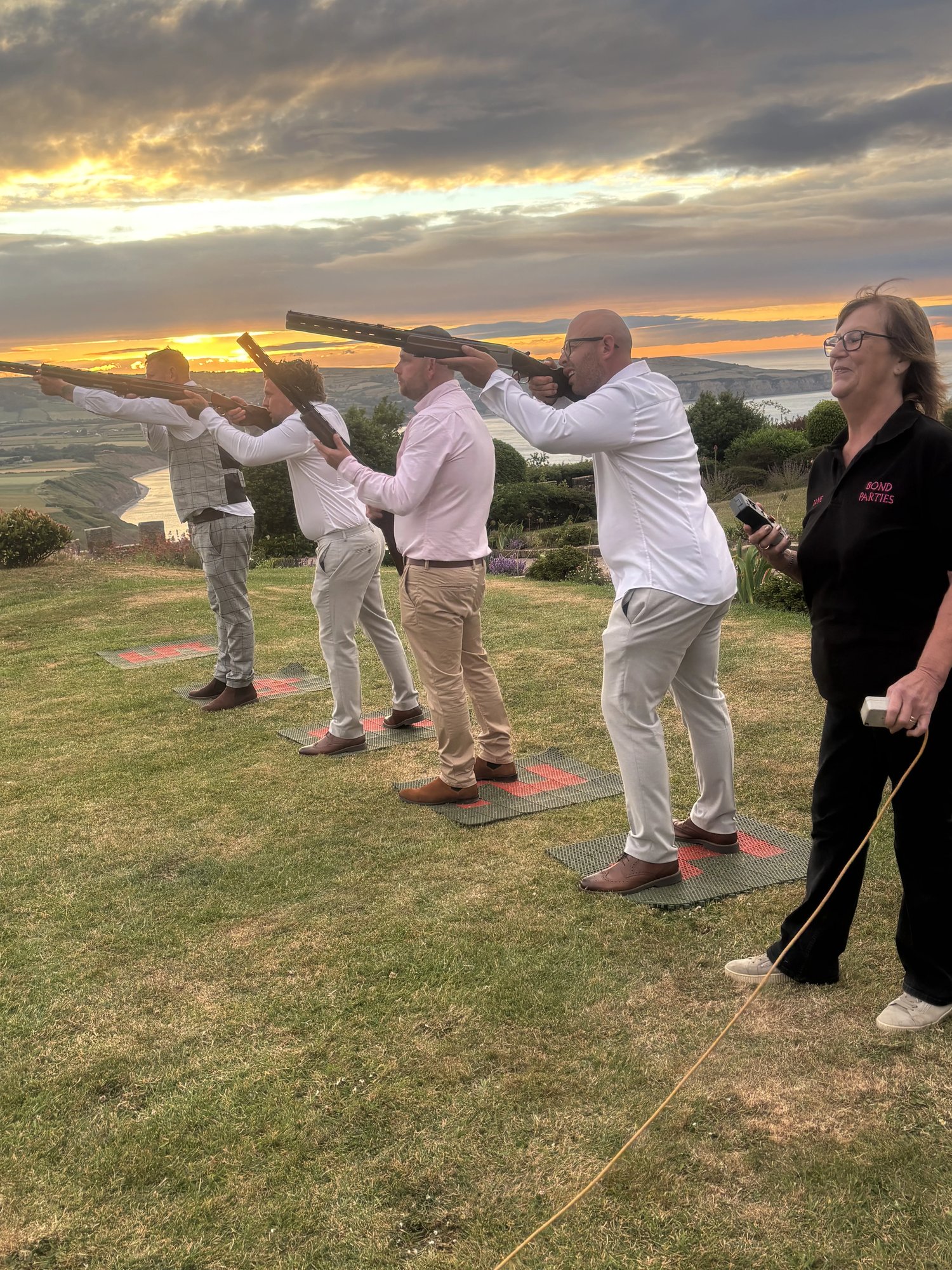 Laser Clay Shooting at sunset with a coastal view